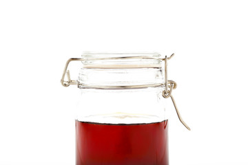 Honey in Mason Jar Isolated on White Background. 