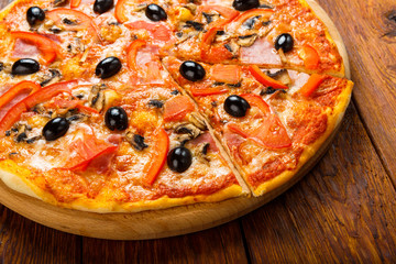 Delicious pizza with salami, mushrooms and olives