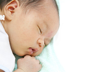 Asian Newborn Baby Girl Sleeping Isolated on White Background.