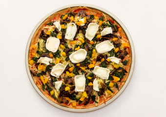 Fresh pizza before placing in the oven.