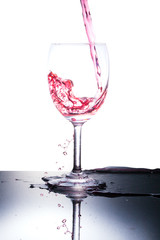glass and red liquid isolated on white background.