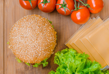 Tasty cheeseburger with lettuce, beef, double cheese and ketchup. Shallow focus.