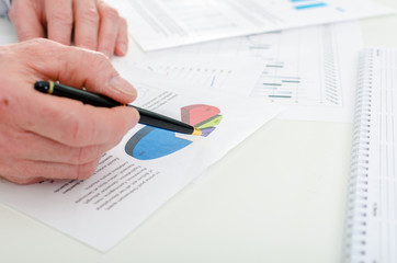 Businessman checking financial charts