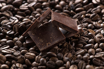 Chocolate on coffee background, selective focus