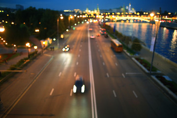 Naklejka na ściany i meble background blur night city traffic lights