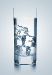 Glass of water with three ice cubes