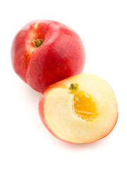 White nectarine whole and sliced over white