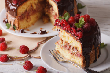 sliced raspberry cake with fresh berries close up horizontal
