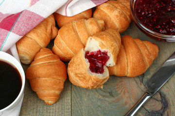 Breakfast, croissants with jam and coffee