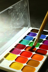 old watercolor paints and brushes
