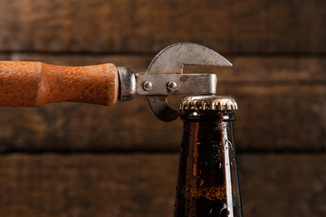 Bottle of beer and vintage opener