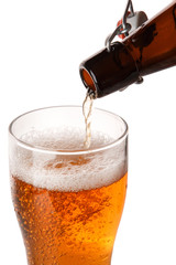 Beer is pouring into a glass