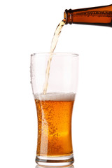 Beer is pouring into a glass