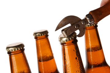 Bottles with beer and vintage opener