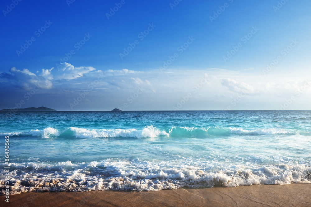 Wall mural seychelles beach in sunset time