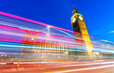 Poster Light trails of Red Bus in front of Big Ben and Westminster Pala © jovannig