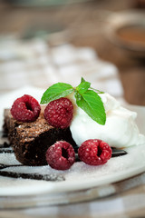 Chocolate brownie  with raspberry and mint