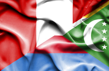 Waving flag of Comoros and Peru