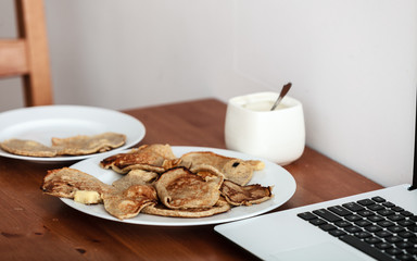Fried apple in pancake dough or apple fritters with icing sugar