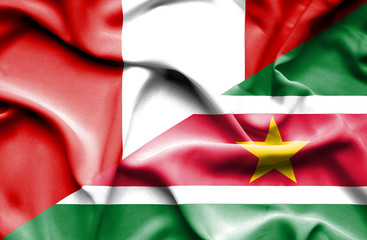 Waving flag of Suriname and Peru