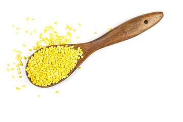 Mung beans in wooden spoon isolated on white