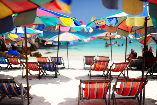Beach chair and colorful umbrella
