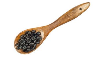 Coffee beans in wooden spoon isolated on white