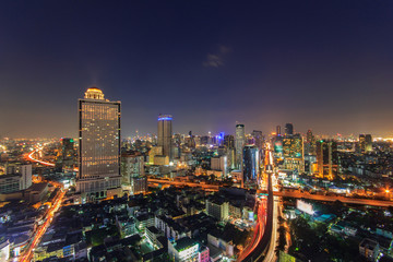 Fototapeta na wymiar Modern building at riverside in twilight scene at Bangkok, Thailand