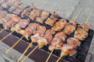 grilling pork in local market