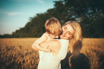 Portrait of happy loving mother and her baby outdoors
