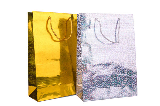silver and gold Shopping bags on white background