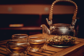 Glass chinese teapot with herbs