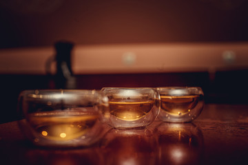 Glass tea cups in a shadow