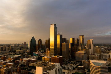 Aerial view of Downtown Texas at golden hour with the golden hues of the sun reflecting off the glass buildings. - 86486341