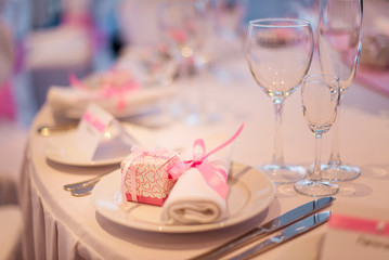 Festively laid table. Napkin and bonbonniere