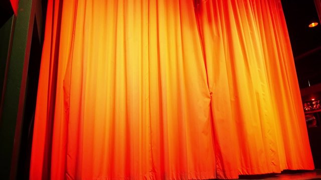 Red Curtain or Drapes with Colorful Spotlight on the Scene