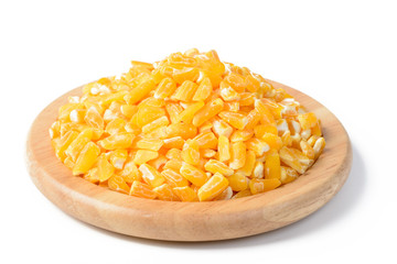 yellow corn grits in the wooden plate, tilt shift lens