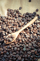 Coffee beans and wooden spoon with filter effect retro vintage s