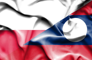 Waving flag of Laos and Poland