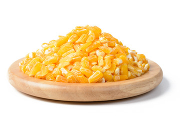 yellow corn grits in the wooden plate, tilt shift lens