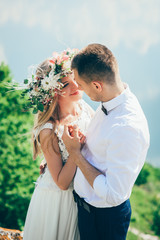 couple on blue sky background, water
