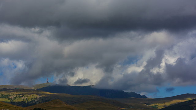 Clouds running over blue sky time lapse, Bucegi, Caraiman, Romania