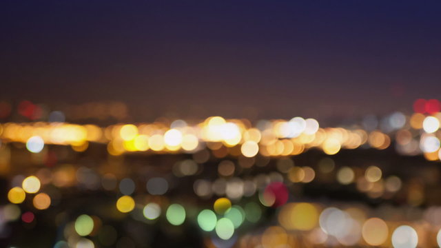 City lights blur at night. London