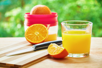 Glass, knife oranges and juicer