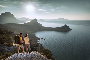 Fototapeta premium Hikers look at sunrise
