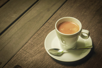 cup of coffee latte on the wood texture