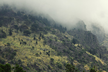 mountain landscape in Europe river gorge clouds