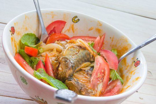 Salad with mackerel in tomato sauce