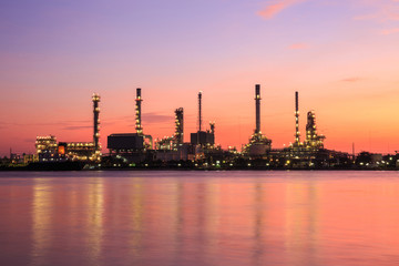 Oil refinery silhouette along the river at sunrise time (Bangkok, Thailand)