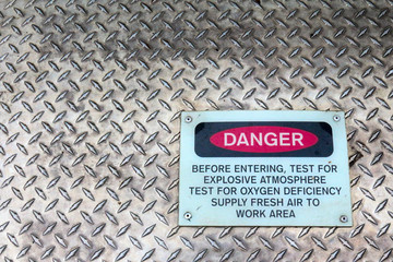 Danger sign on a confined space sign warning of explosive atmosphere